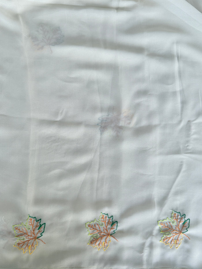 Pastel green maple leaf emb georgette saree