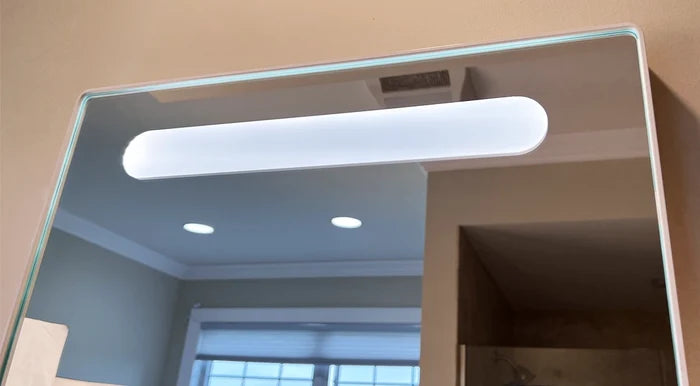 Framed LED bathroom mirror with storage shelf and motion sensor, 22x34