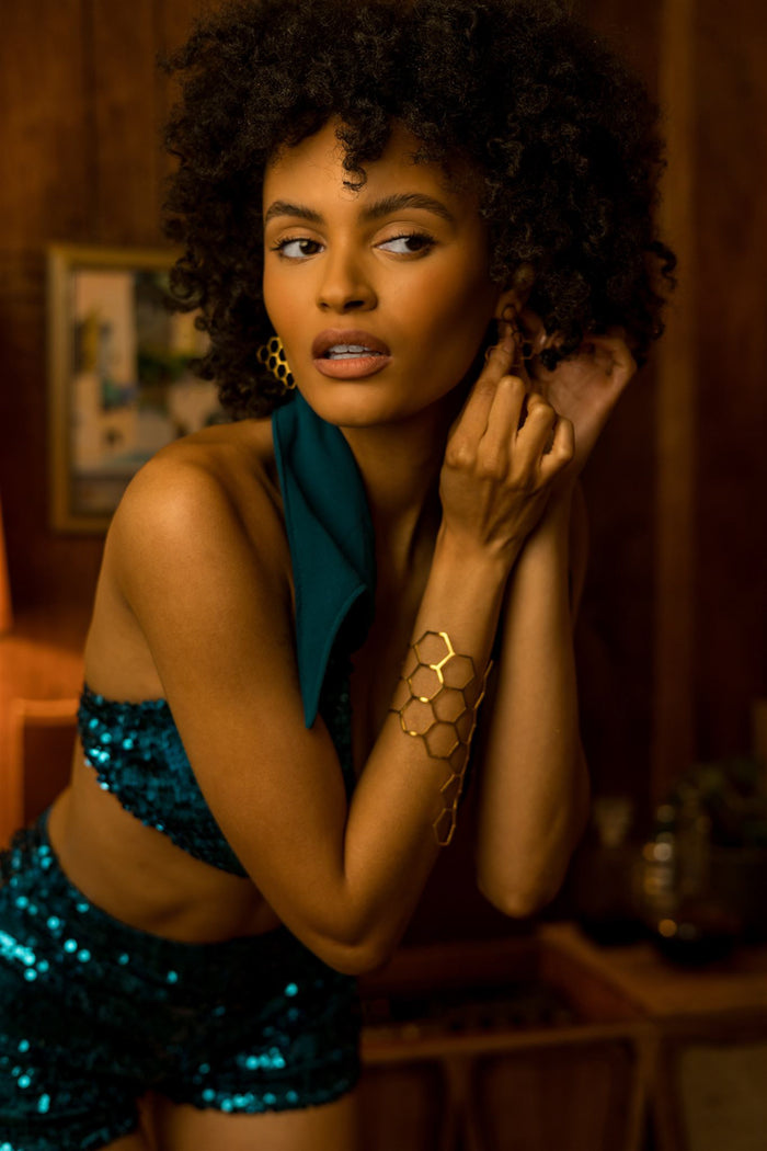 Beauty babe in Soul Sister since 1969 -  beverly sequin shorts putting on earrings