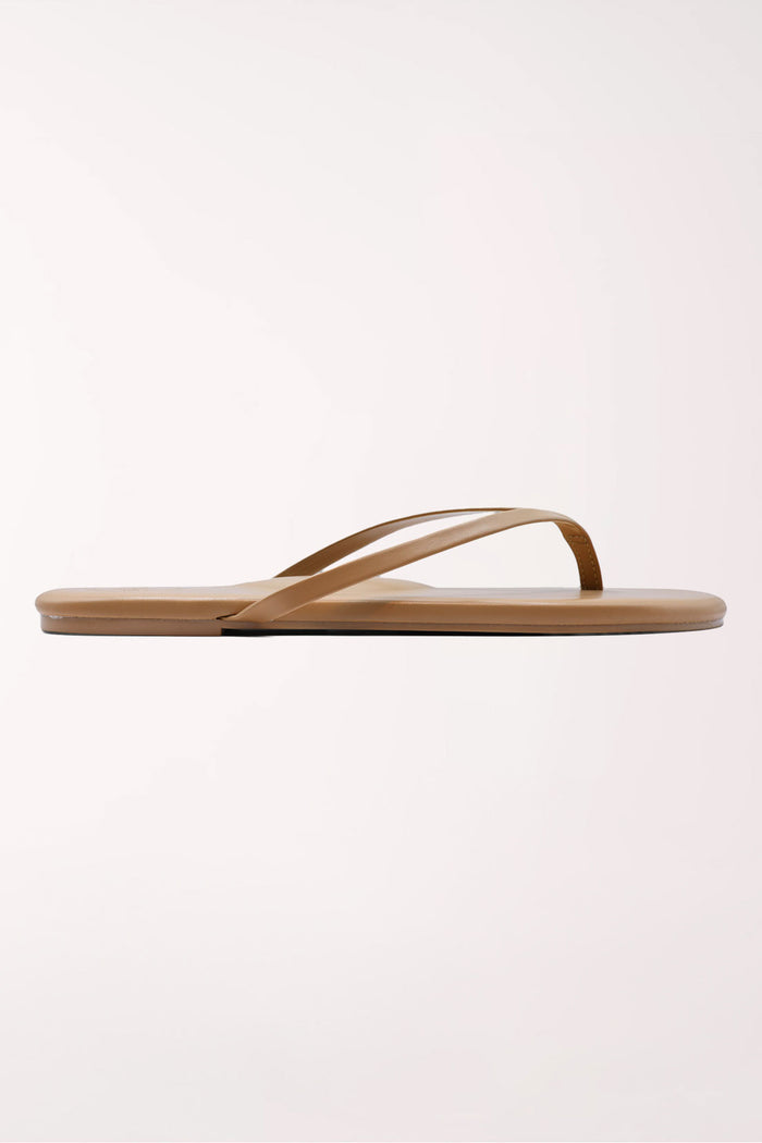 Pair of brown flip-flops on a white background