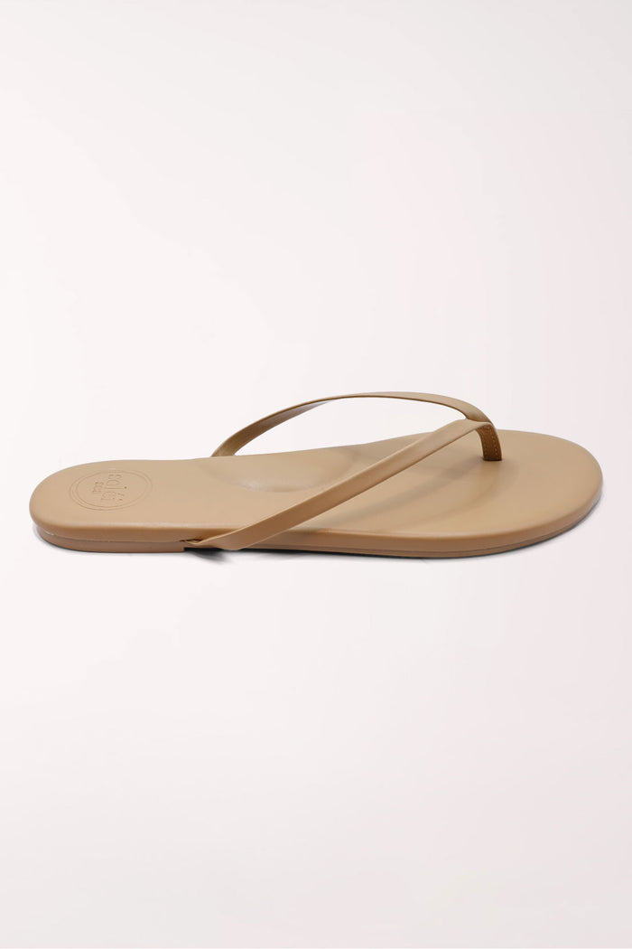 Pair of brown flip-flops on a white background
