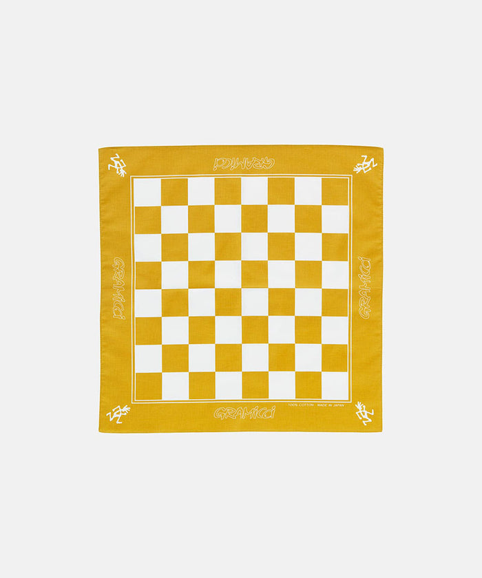 Yellow orange Gramicci Checkers Bandana against a light-tone background.