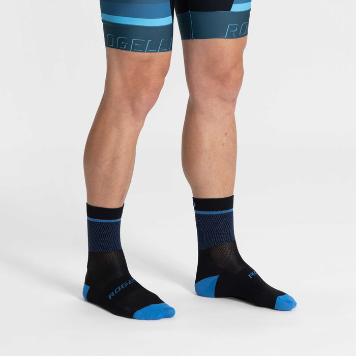 Rogelli Hero II fietssokken winter heren zwart en fluor gedragen.
