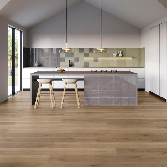 Modern kitchen with a grey tiled island and wood effect luxury vinyl floor.