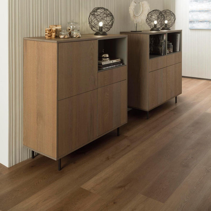 Two wooden sideboards with decorative items on a wood effect luxury vinyl floor.
