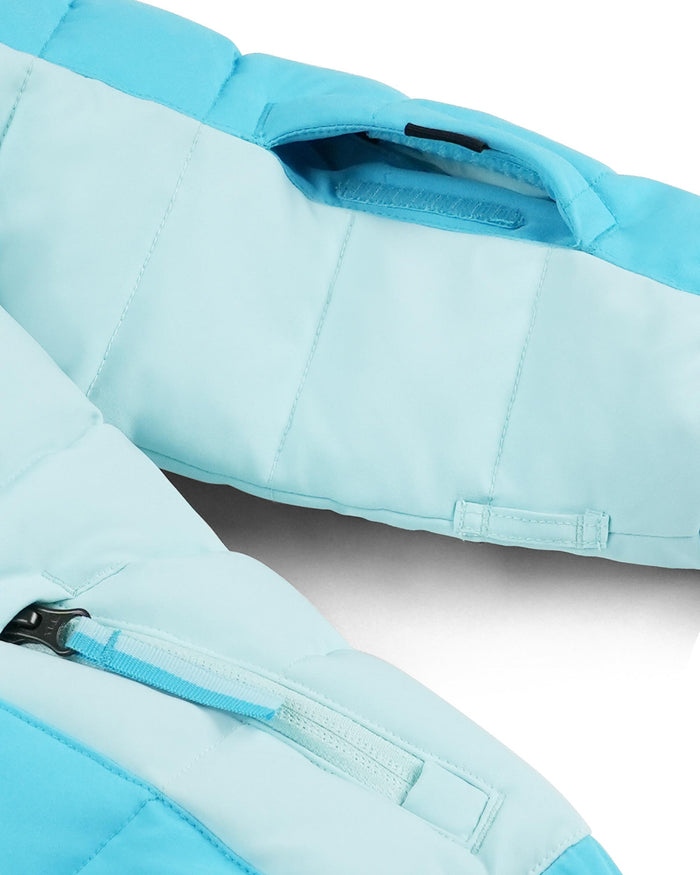 Close-up of a light blue and white jacket with zippers on a white background