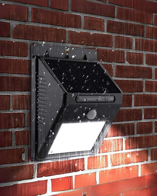 Premsons LED solar motion sensor light on wall with illuminated LED panel