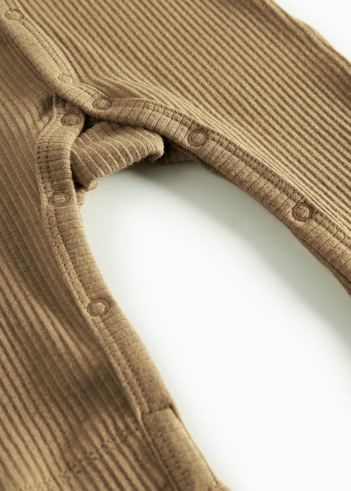 Ribbed brown jumpsuit for baby in soft material with long sleeves and long legs and snaps