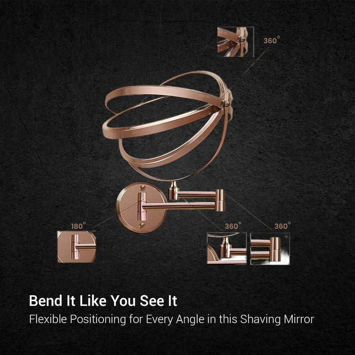 Round 3x magnification shaving mirror with rose gold rim and adjustable pivot arms on dark grey marble - Glazonoid