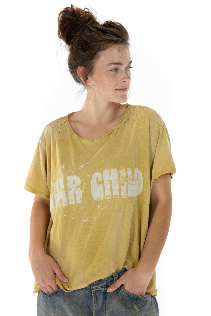 Woman in Magnolia Pearl distressed yellow Star Child t-shirt, vintage artisan whimsical clothing