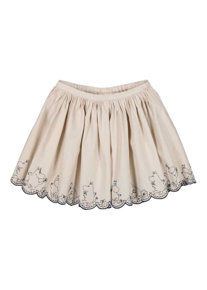 Beige nederdel med elastisk talje, moomin-figurer hele vejen rundt og bølget pyntkant.
