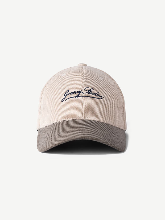 GROOVY UTOPIA two-tone corduroy cap in cream with ribbed texture and script logo