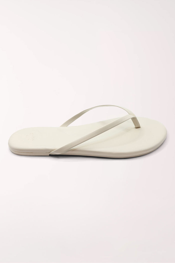 Pair of white flip-flops on a light gray background
